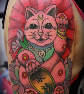 Red awesome cat tattoo on arm