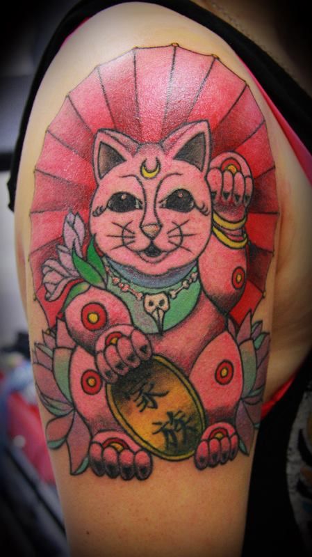 Red awesome cat tattoo on arm