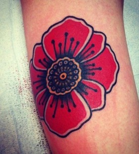 Red awesome poppy tattoo on leg