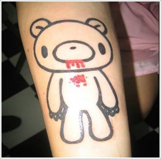 Red blood and black bear tattoo on arm