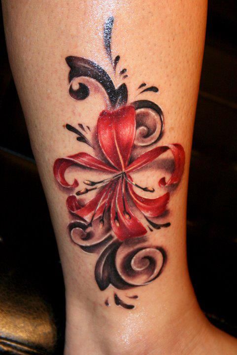 Red flower tattoo on leg