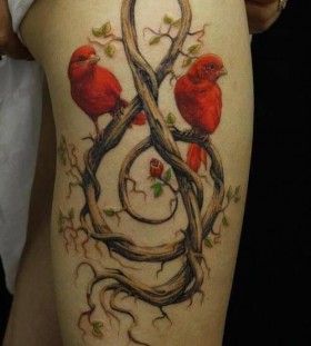 Red lovely bird tattoo on leg