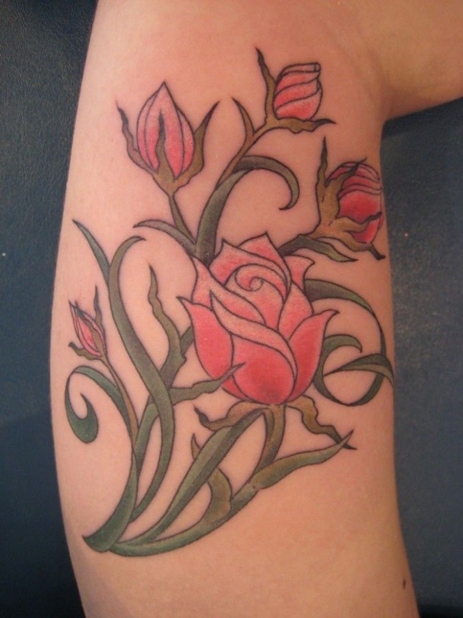 Red pretty rose tattoo on arm