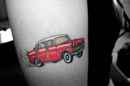 Red pretty small car tattoo on arm