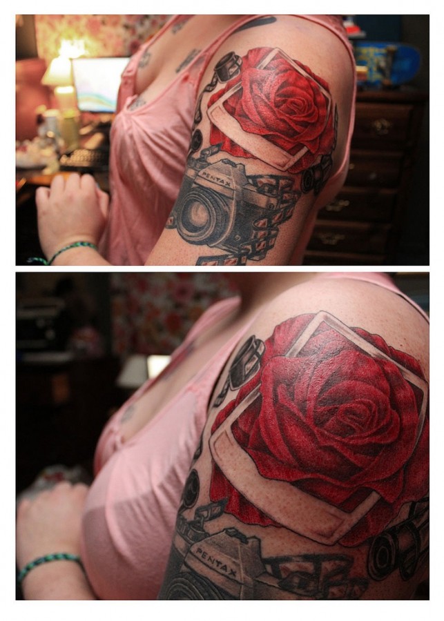 Red rose and pentax camera tattoo on arm