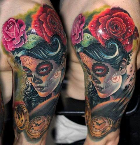 Red rose, women and skull tattoo on arm