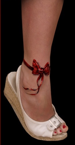 Red simple bow tattoo with shoes