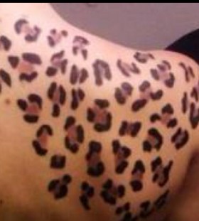 Red tiger cat tattoo on arm