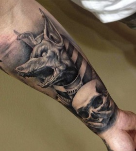 Scary skull and dog tattoo on arm