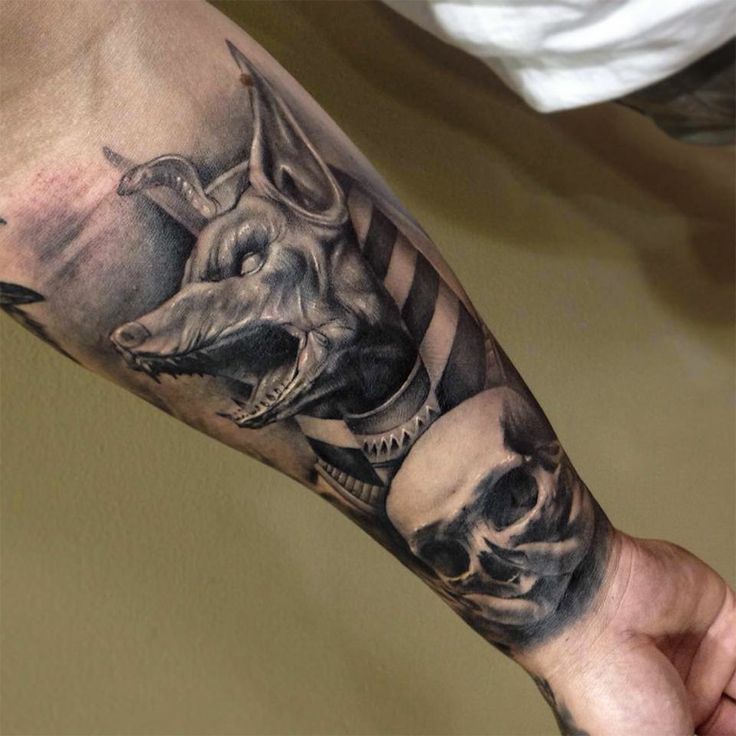 Scary skull and dog tattoo on arm