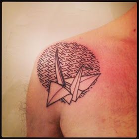 Schemes and bird origami tattoo on shoulder