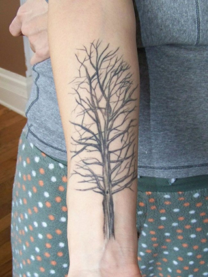 Simple black tree tattoo on arm