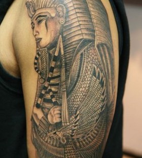 Simple egypt style face tattoo on arm