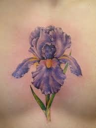 Simple purple flower tattoo on chest