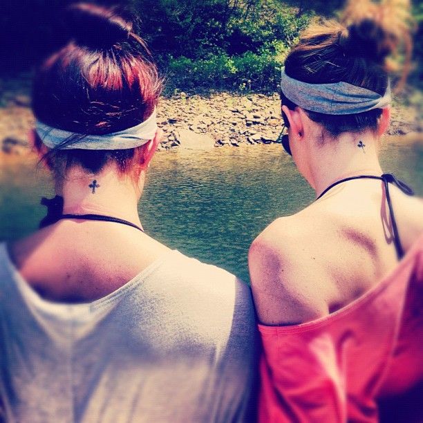 Sisters black back cross tattoo