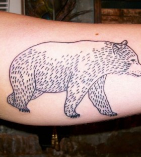 Small lovely bear tattoo on arm