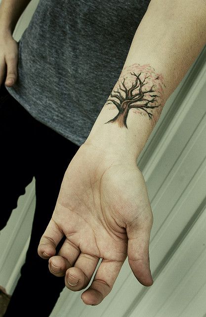 Small lovely tree tattoo on arm