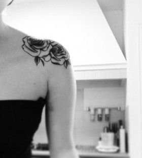 Small pretty black and white color rose tattoo on shoulder