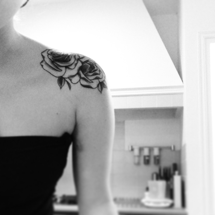 Small pretty black and white color rose tattoo on shoulder