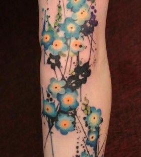 Small pretty blue flowers tattoos