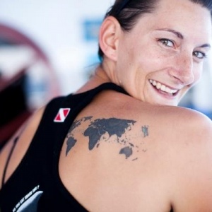 Sports womens and map tattoo on back