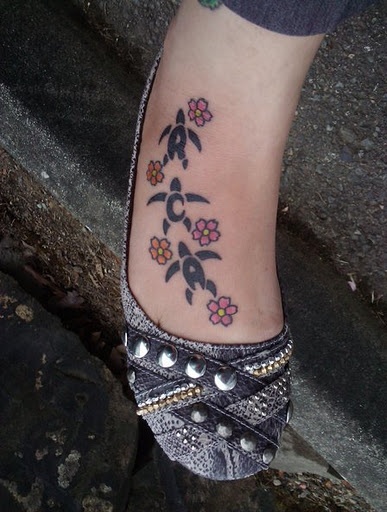 Turtles and small flowers hawaiian style tattoo