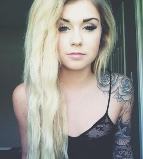 Unique blonde girl rose tattoo on shoulder