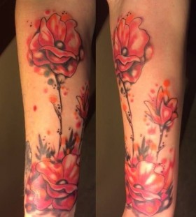 Watercolor red poppy tattoo on arm