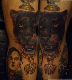 Women and black tiger tattoo on leg