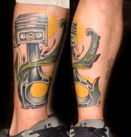 Yellow sun and mechanism of car tattoo on leg