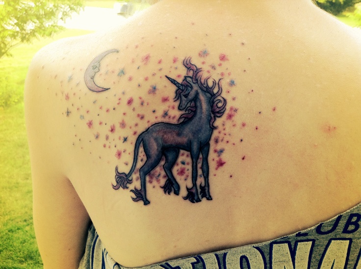 unicorn tattoo with the moon on the back