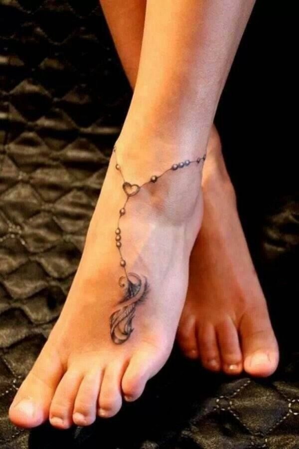 Adorable black girl tattoo on foot