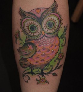 Adorable owl green tattoo