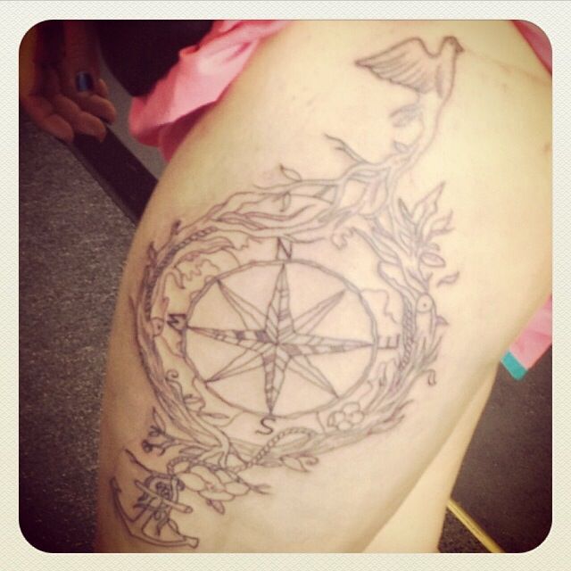 Anchor ornaments compass tattoo on leg