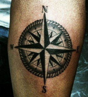 Awesome looking black compass tattoo on arm