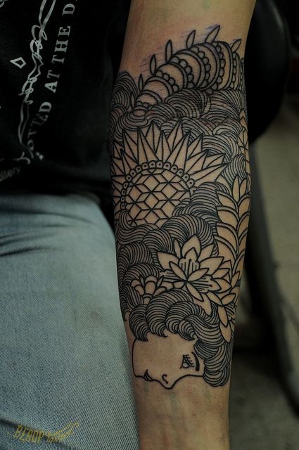 Awesome looking geometric arm tattoo