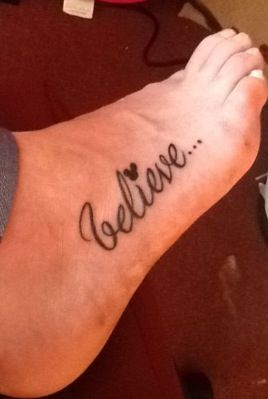Believe quote Mickey Mouse tattoo on leg