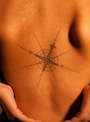 Black adorable compass tattoo on back