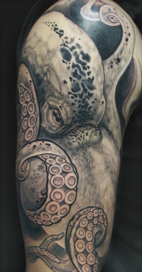 Black and white octopus tattoo on arm