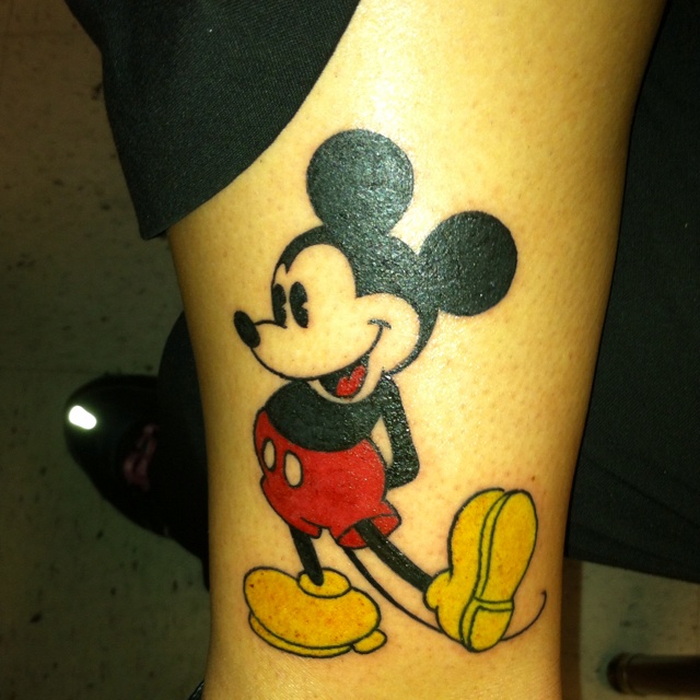 Black funny Mickey Mouse tattoo on leg