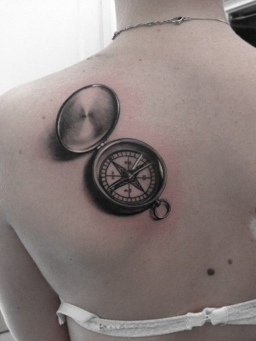 Black gorgeous compass tattoo on back