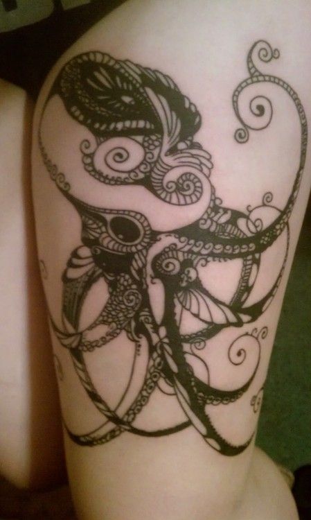 Black lace and octopus tattoo on leg