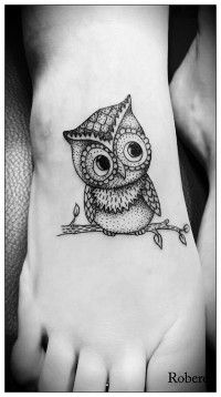 Black owl girl tattoo on foot