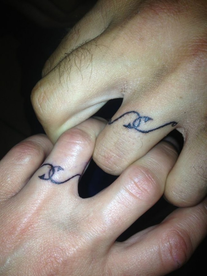 Black ring of fishing tattoo