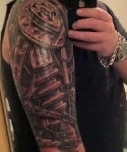 Black shoulder robbot tattoo