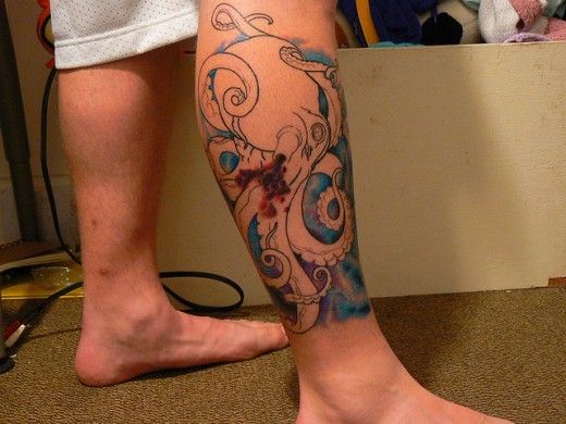 Black simple octopus tattoo on leg