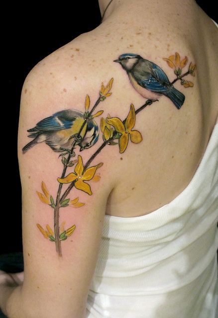 Blue birds and yellow tattoo