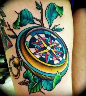 Blue lovely compass tattoo on arm
