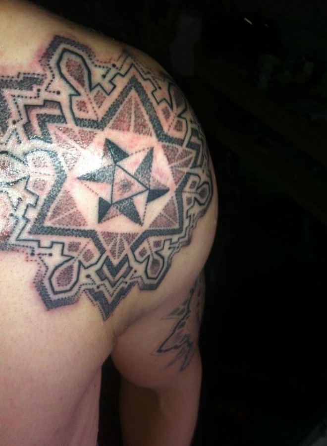 Brown and black stars geometric shoulder, back tattoo