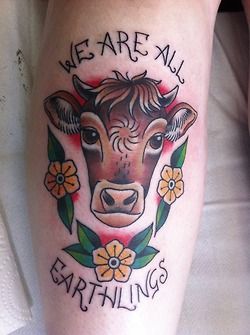 Brown black cow tattoo